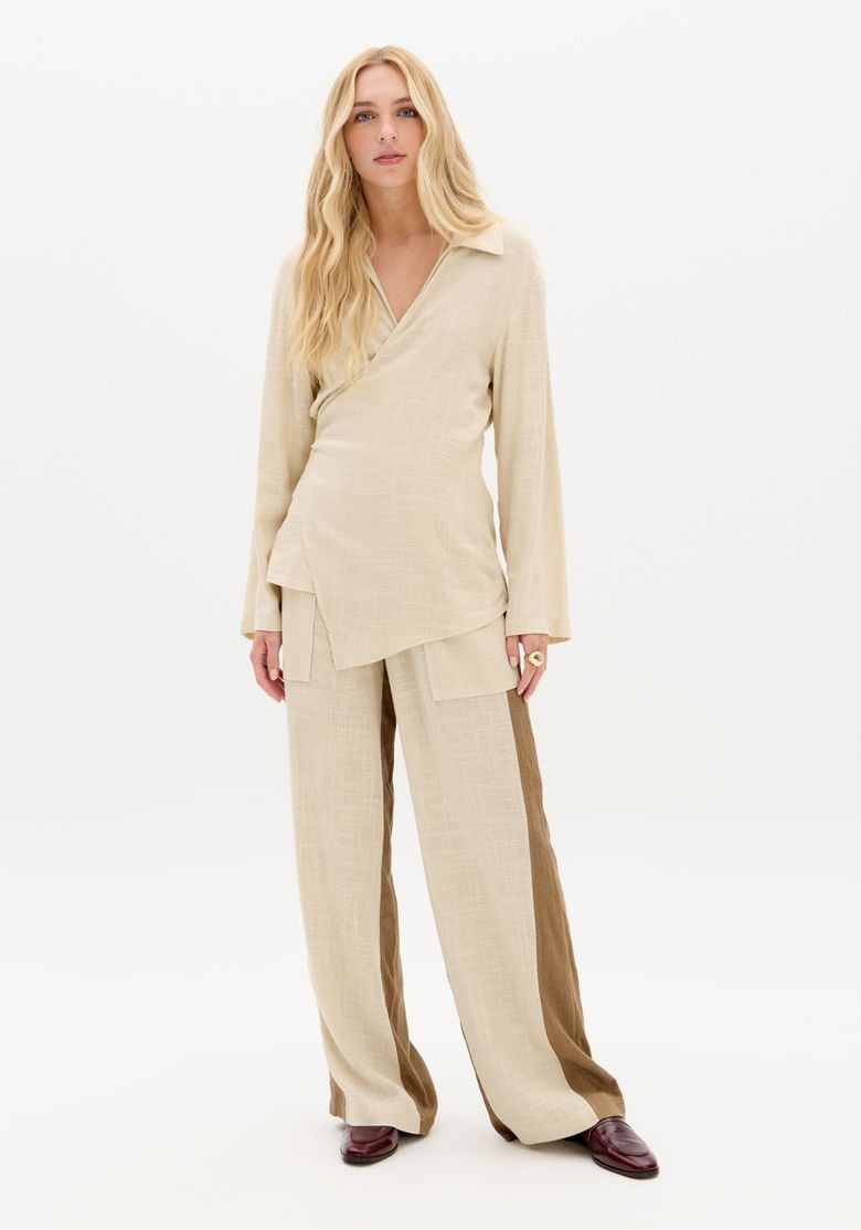 Camisa-feminina-alongada-com-amarracao-lateral-combinada-com-calca-ampla.