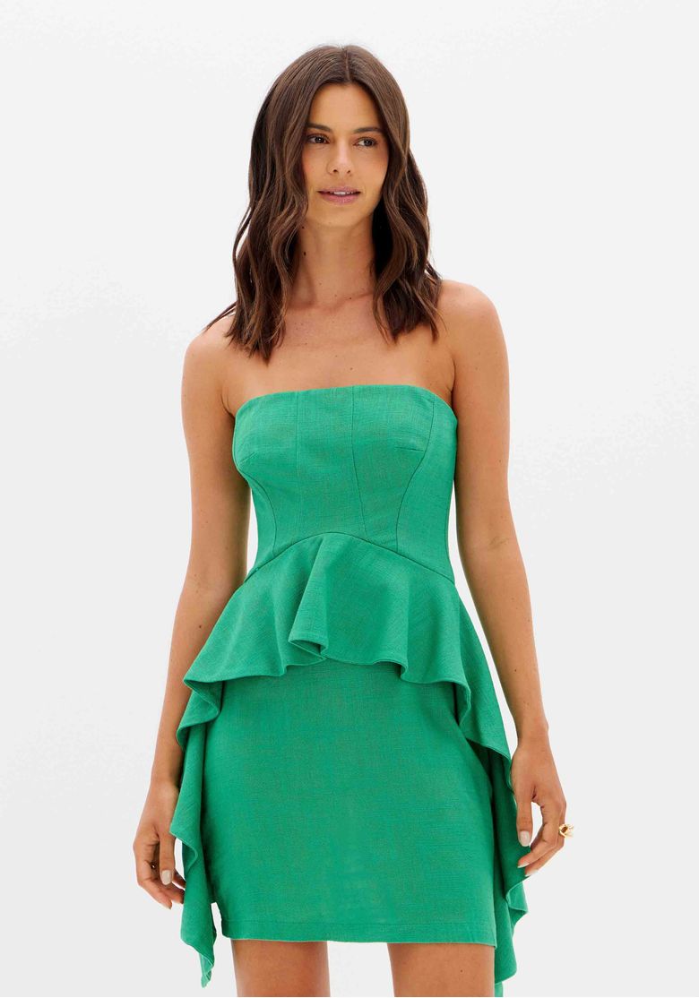 Detalhe do tecido e babados do vestido curto verde.
