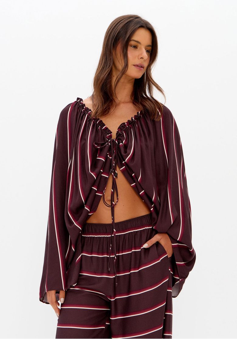 Blusa ampla listrada com ajuste frontal e mangas longas.